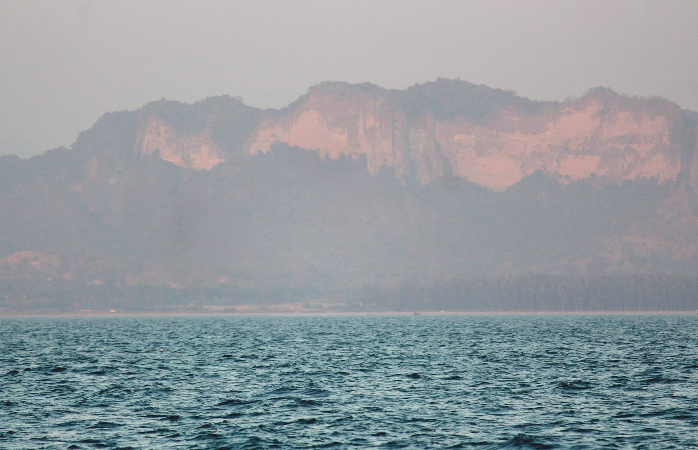 Distant cliffs across calm water